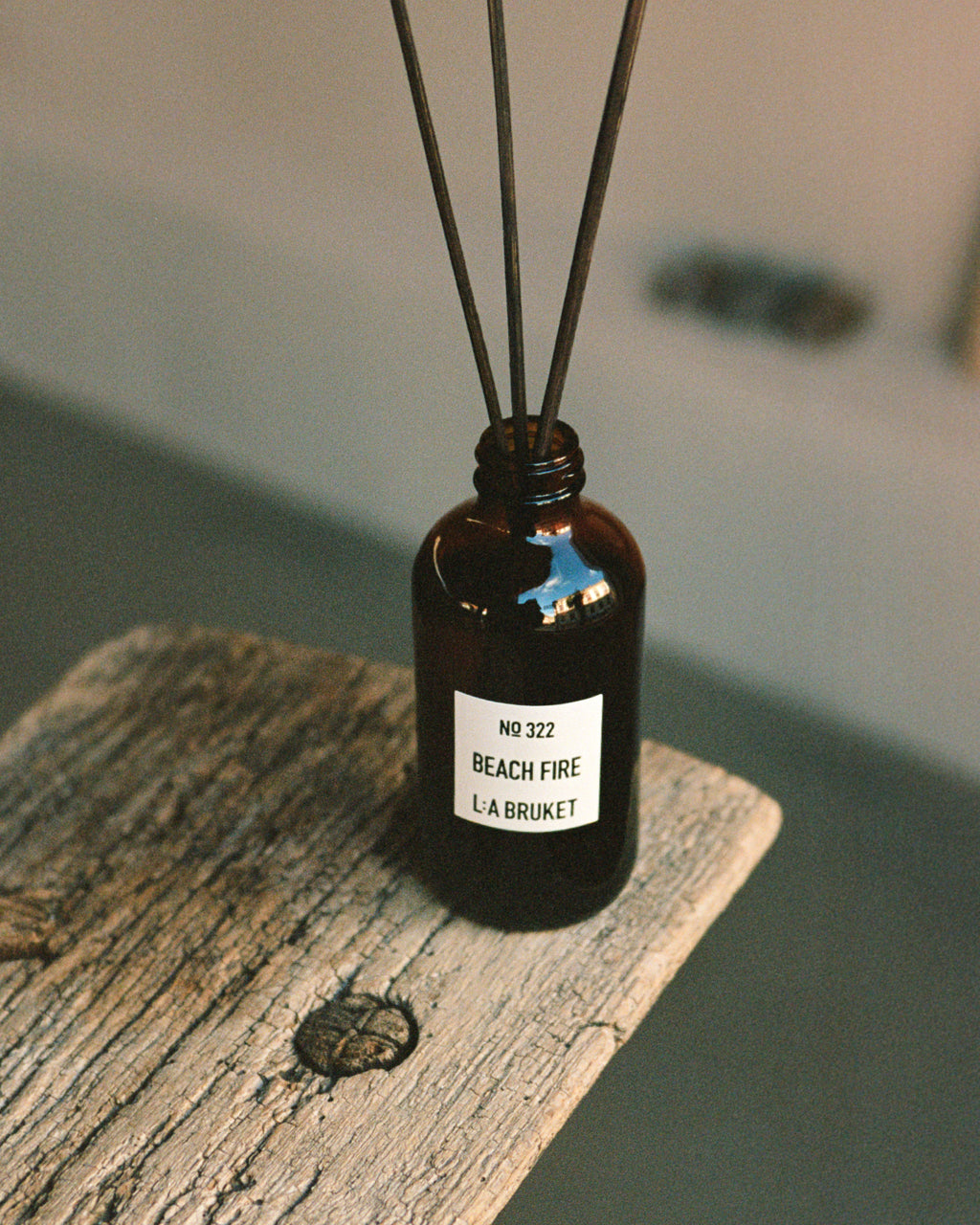 L:A BRUKET Beach Fire room diffuser styled on weathered wood