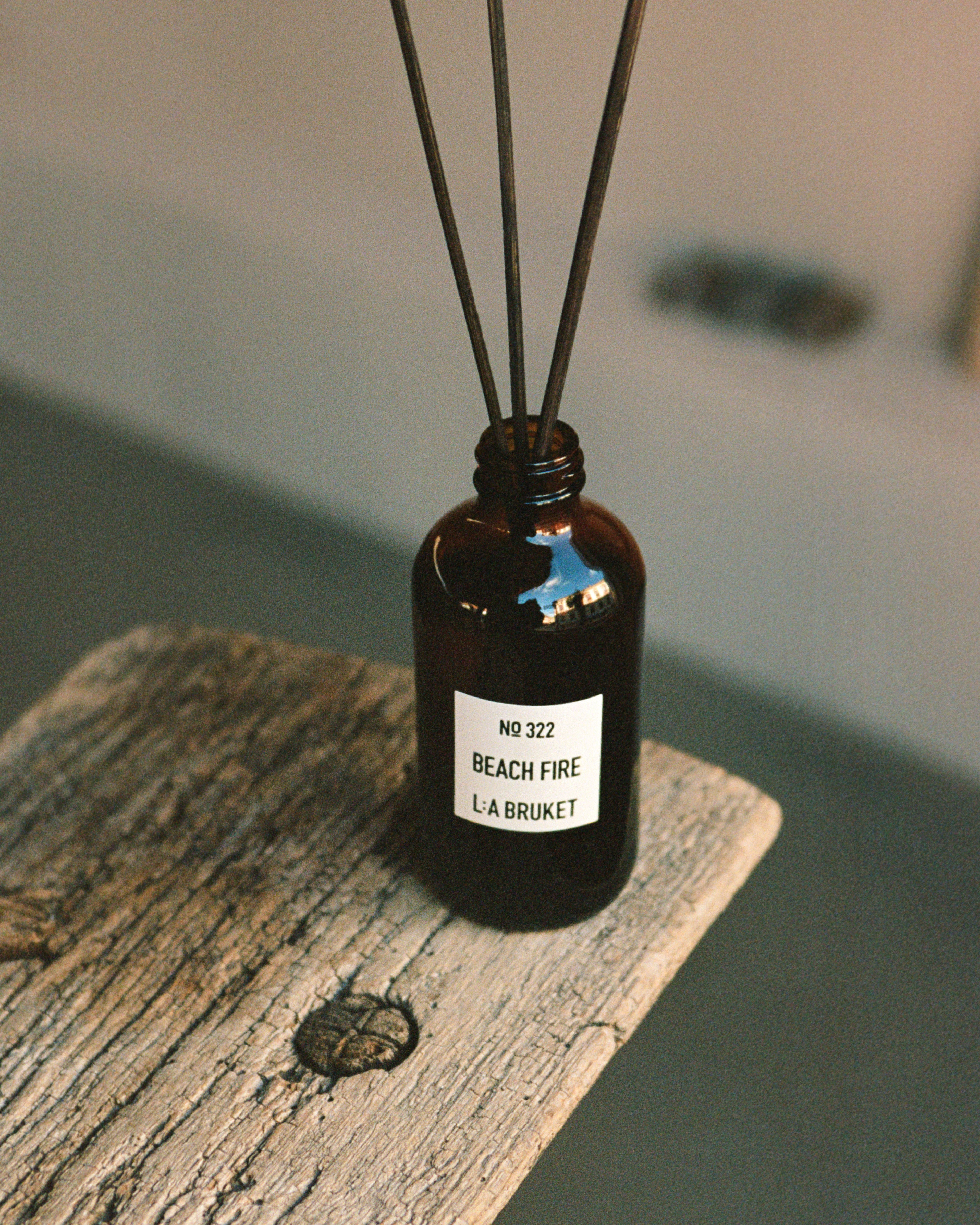 L:A BRUKET Beach Fire room diffuser styled on weathered wood