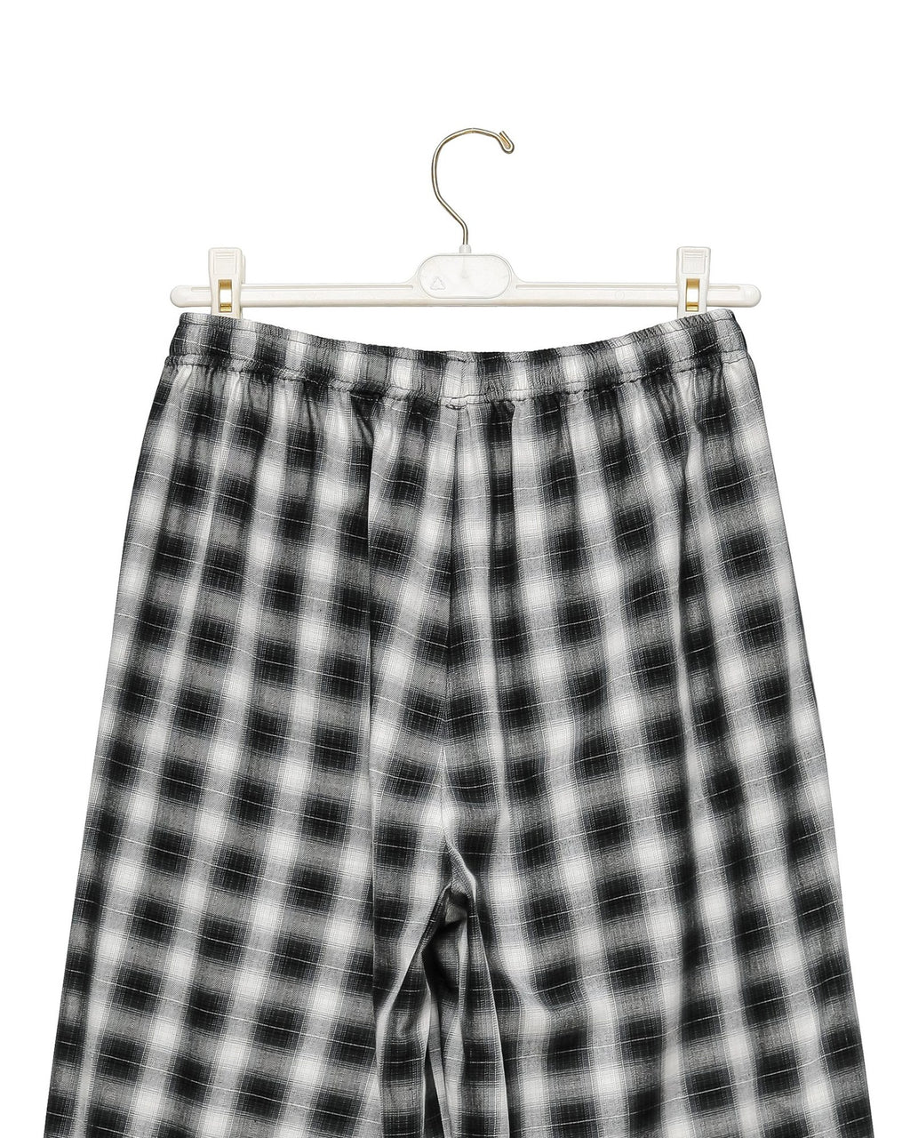 Waistband and drawstring detail of the plaid check wide pants on a hanger